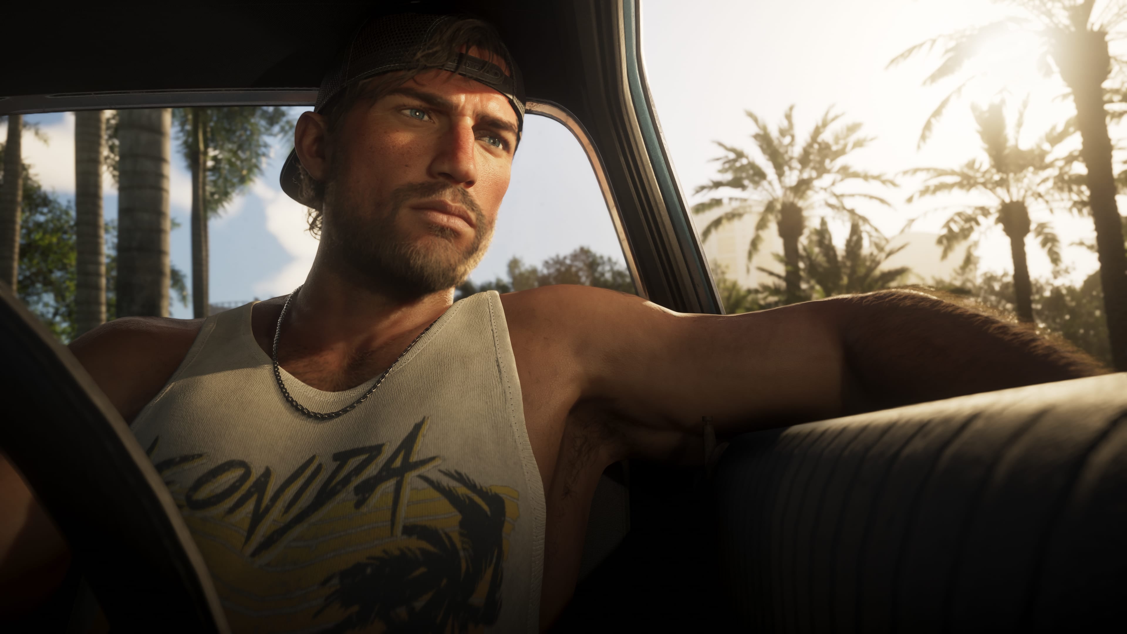 Jason Duval drives through Leonida with palm trees in the distance.