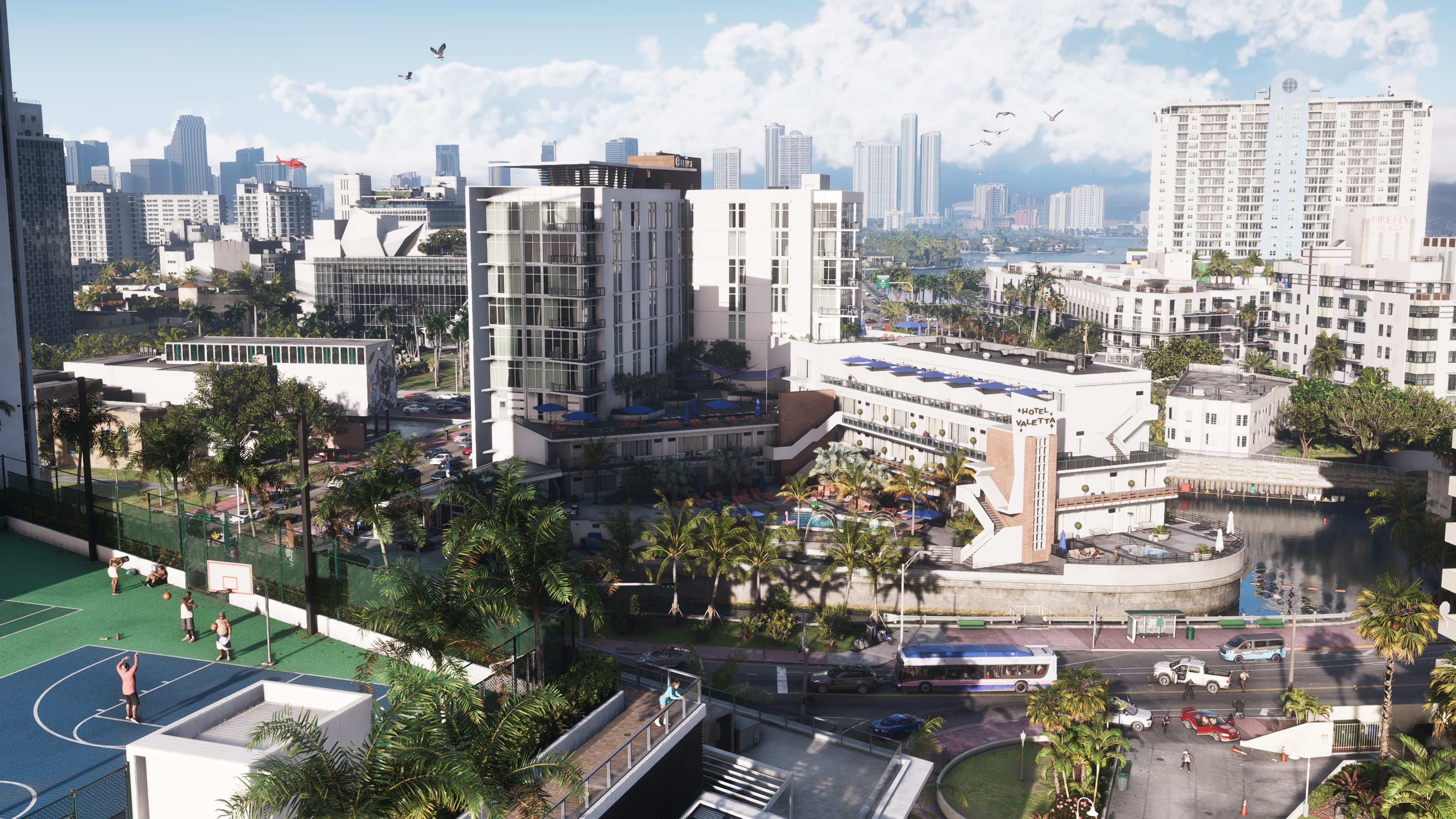 Official GTA VI image of a palm-lined Vice City block viewed over a basketball court.